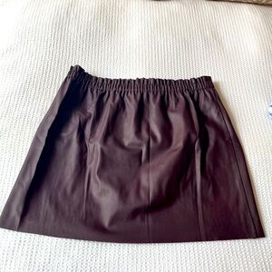 Burgundy Faux leather skirt with elastic waist.